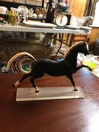 Metal horse on lucite stand