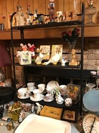 Glassware, including a cup and saucer collection, several pieces of waterford, and lots of crystal.