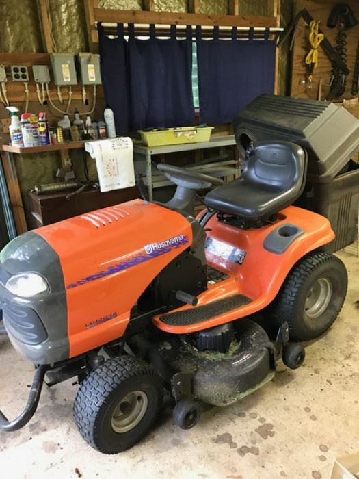 Well maintained 42" Husqvarna riding mower, that's still cutting this yard! 
