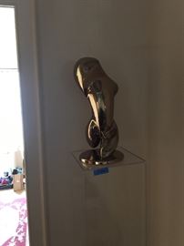Polished bronze torso sculpture on lucite stand 