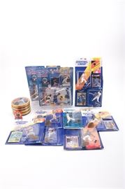 Baseball Memorabilia featuring Ken Griffey Jr.: An assortment of Ken Griffey Jr. memorabilia. Includes ten Starting Lineup Sports Superstar collectible figures, cards and more. Each item is presented unopened in its original packaging.