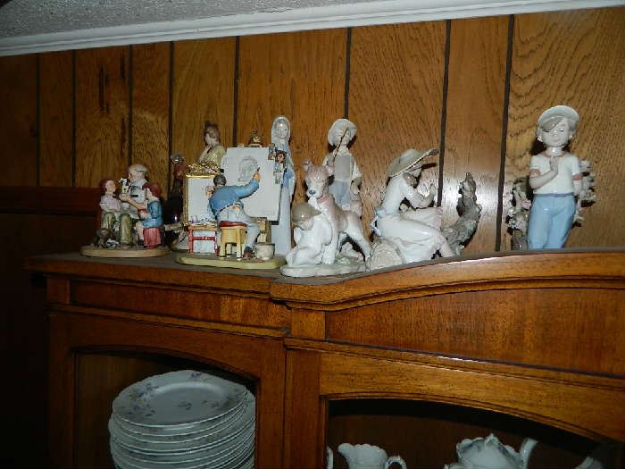 More Lladro, Norman Rockwell, and other pieces.  A great set of Limoge china also in Cabinet.