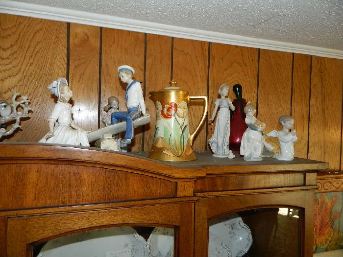 View of Lladro figurines, Hand painted Nippon, signed by artist, other figurines, and a Murano glass lamp base, you have to see to believe all the wonderful things in this estate!