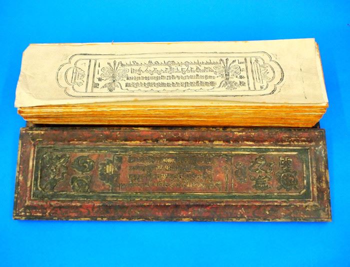 Lot 88-2:  Nepalese Book of the Dead, with Carved and Polychrome Wood Covers and Multiple Printed Loose Leaves