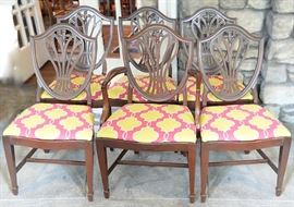 Set of six mahogany Hepplewhite style chairs with pierced shield backs. The set consists of one armchair and five side chairs all with padded seats in a contemporary fabric.
Condition
good: wear to surface consistent with age and use, one side chair has a broken top rail
Starting Bid
$150.00
