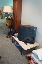 coffee table, tv, lamp and cd cabinet.