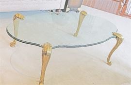 Stunning French Glass Top Coffee Table    $449
1/2 " thick glass with fluted edges all around
4 brass legs attach directly to the glass
Approx 4 ft long and 2.5 ft wide
This is a Beautiful piece of French furniture