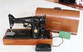 Antique Singer Sewing Machine      $99
Has wooden case, control pedal, & Button Hole Maker
Works Great !!