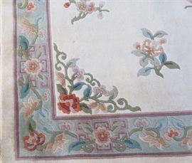 Beautiful Chinese Hand Made Area Rug     $49
wool, neutral color--Beige Background
Patterns of flowers on corners & interior
3/8 inch thick
very good condition