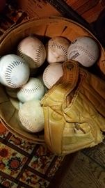 Basket of hard balls & glove