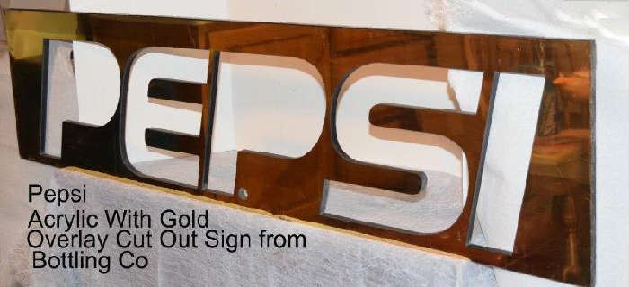 Cut out Pepsi sign with gold overlay