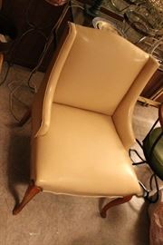 pair of leather wing back chairs