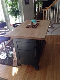 Married maple butcher-block constructed top on an antique bureau base with many drawers, doors