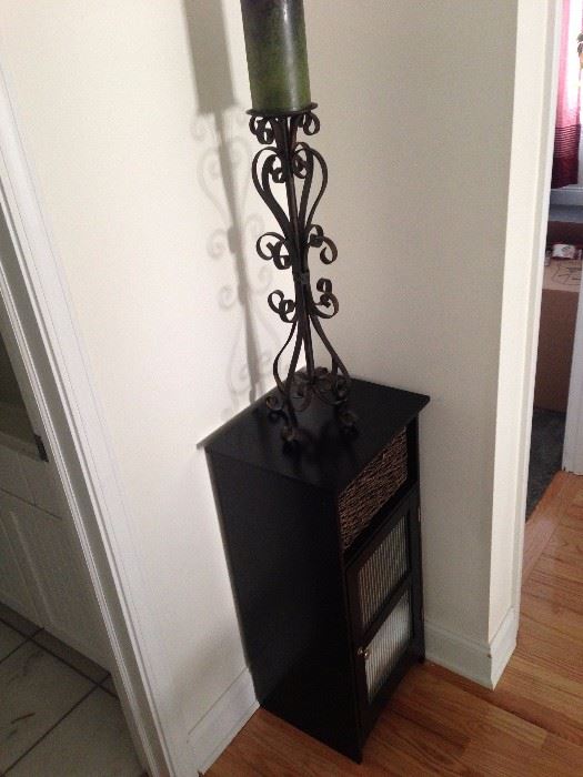 Small cabinet with iron candle holder