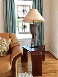 African Mask Lamp, one of a pair; Stressless wedge end table, one of a pair.