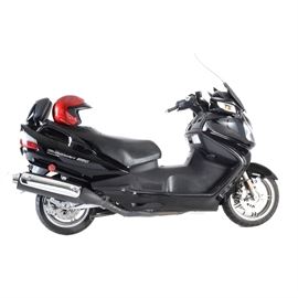 2008 Black Suzuki Burgman 650 Executive Motorcycle: A 2008 Black Suzuki Burgman 650 Executive motorcycle. VIN# JS1CP51BX82100493 Odometer reads 21809. With the largest engine in its class, the Suzuki Burgman 650 features a 4-stroke, 2-cylinder, DOHC, 4-valve 638cc engine with a technically advanced Suzuki Electronically Controlled Continuously Variable Transmission (SECVT™). There is a well-padded seat complete with a backrest for the rider and generous under seat storage capable of holding helmets (helmets not included). Stylish black on black color scheme with silver trim. Also included is an American made welded aluminum loading ramp for easier towing of this vehicle.