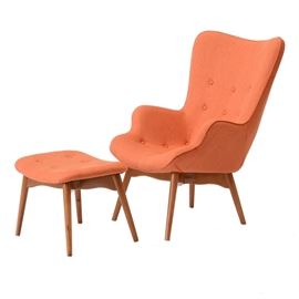 Contemporary Grant Featherston Contour Chair and Ottoman Replica: A contemporary replica Grant Featherston Contour chair and ottoman. The chair features tapered legs and an organic shape with button tufting details on both pieces. The bases and legs have solid beechwood construction with a light finish. The burnt orange woven upholstery fabric covers the chair and ottoman top with the chair fabric having a zipper detail up the backside. The Contour chair was designed by Grant Featherston, a Victorian craftsman, in 1951. The design was inspired by the Arts and Crafts movement and has been thought of as a quintessential Austrailian furniture design.