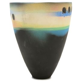 Contemporary Hand Thrown and Hand Painted Vase: A contemporary wheel thrown stoneware vase. Artisan crafted, the bullet-shaped shaped vase is glazed with underglazes in matte hues of blue, green and cream, with abstract incised accents. Hand-signed “Muller” to the underside.