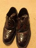 Over a dozen Pairs of nice men's leather dress shoes.