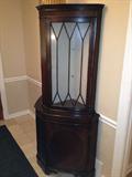 2 corner china cabinets.
