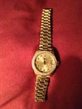 18kt gold Ladies Presidential Rolex w/ Diamond Bezel and Diamond Face Markers.