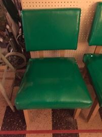 Soft retro green chairs - one chair a little wobbly