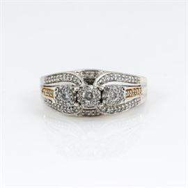 10K Yellow Gold, Sterling Silver and Diamond Ring: A 10K yellow gold, sterling silver, and diamond ring.