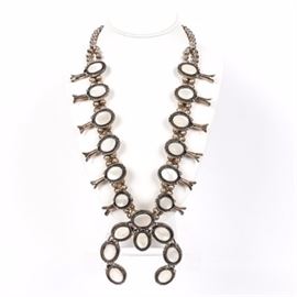 Robert Skeet 800 Silver and Mother of Pearl Squash Blossom Necklace: A Robert Skeet 800 silver and mother of pearl squash blossom necklace.