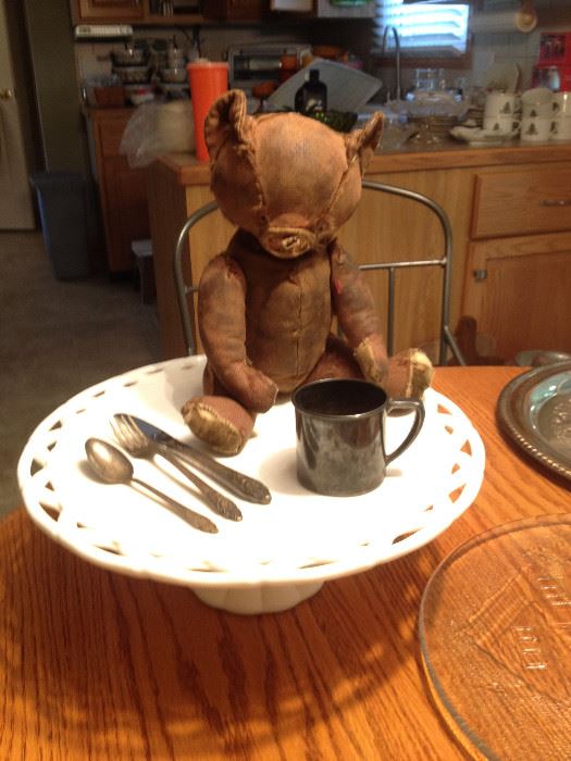 Adorable Teddy Bear (leather) Mohair is worn off, had a crier and has excelsior stuffing; silverplate child's cup and flatware