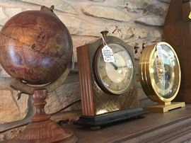 what's inside that globe? It's italian so probably little candies. Electric clock "ChronMaster?" and skeleton or view clock (quartz)