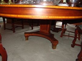 Cross banded and single pedestal mahogany dining room table