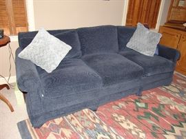 Upholstered sofa and rug 