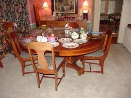 Matching antique dining room pedestal table with inlaid cross banding, two 3 leaves and brass feet