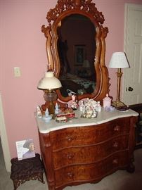 Victorian burled walnut dresser with marble top and bow front.