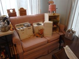 loveseat, childs toy stove, toy sink, wolverine toy refrigerator, ringer washer, curved coffee table, fisher price pull toy, glass cruet holder w/ jars