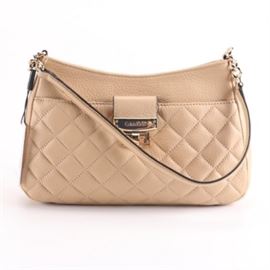 Calvin Klein Nude Leather Handbag: A Calvin Klein nude leather shoulder bag. This bag features a zippered top closure, a single leather and chain strap and a full front pocket where the leather has been quilted. The handbag is finished with a signature print lining, interior pocketing and branded labeling.