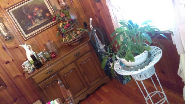vacuum $26 wicker plant stand $18 vintage 3 tier wooden carved fruit stand with fruit $70, fruit oil painting artwork $60, sideboard $210