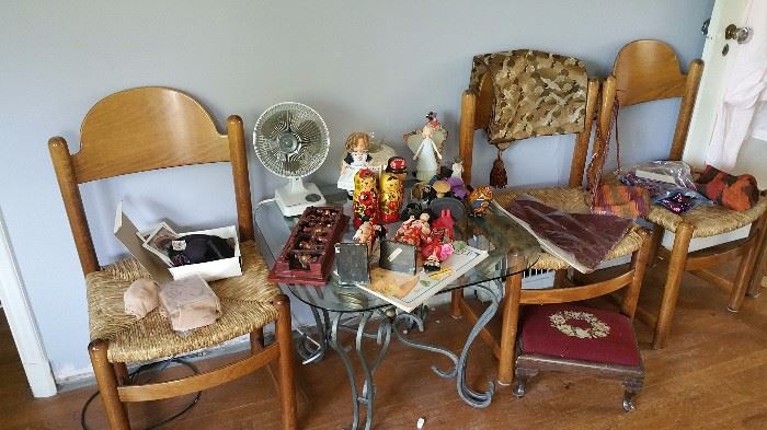 misc items - dolls of different countries, other souvenirs..glass top side table...set of 6 rush seat chairs