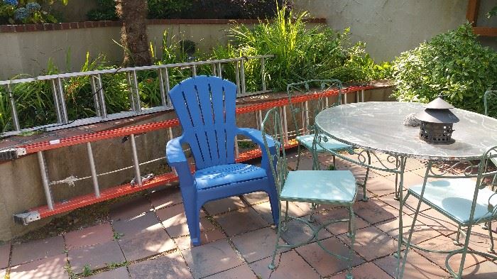 2 large extension ladders, plastic adirondack chair, vintage patio set - round table, 4 chairs, plexi top