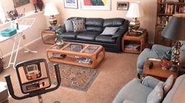 Dark blue/navy leather sofa/couch, mcm/vintage baby blue chairs, matching glass top coffee and end tables