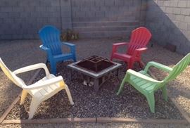 Metal Fire Pit w/ 4 plastic Adirondack Chairs
