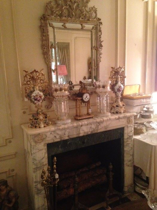 Marble mantel elegant selections; above - fabulous antique mirror