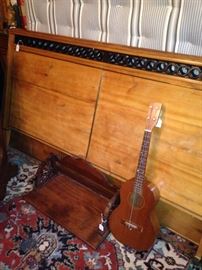 Full bed; antique shelf; vintage guitar