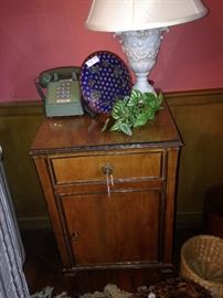 One of two matching nightstands and lamps