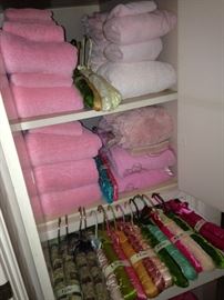 Many towels and padded hangers