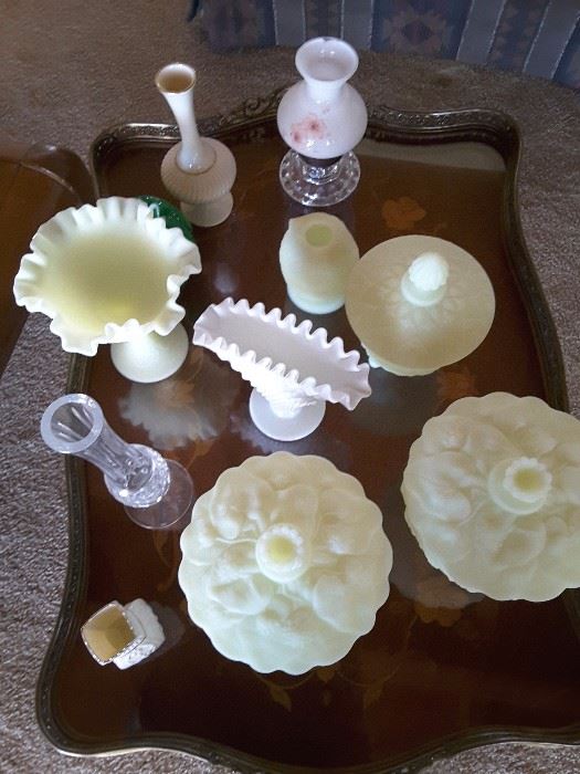 Yellow beige Milk Glass candy dishes, nut dishes with covers, one candle holder, several glass vases, one ruffle white Milk Glass vase. Crystal vase. 