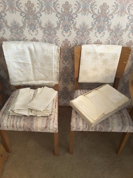 Napkins set with matching table cloths and runner. Chairs to the dining room table.