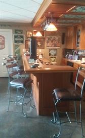 Lots of bar items, glasses, bar stools and more