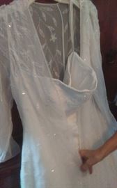 Beautiful wedding dress with sheer floor length overlay and train