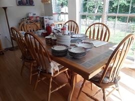 Tile top kitchen table, 1 leaf 6 chairs and 2 matching rolling buffets/sideboards